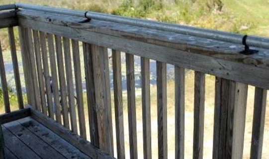 A coyote roller installed on a railing will prevent vultures from perching.